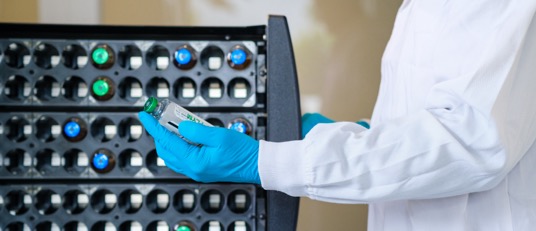 a smiling family dressed formally posing in front of their home